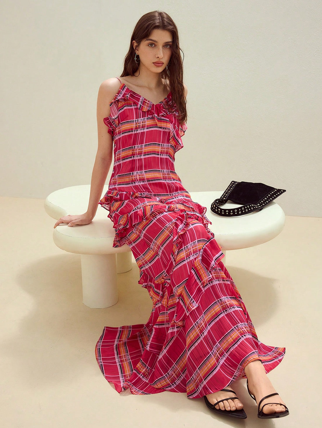 Step into summer with the Plaid Ruffle Trim Cami Dress, where playful charm meets effortless style. Its delicate ruffle trim adds a flirty touch, while the classic plaid pattern keeps things fresh and fun. Perfect for sunny days, casual outings, or spontaneous adventures, this dress brings a breezy vibe to any occasion. Embrace the season with a look that’s as lively and lighthearted as you are!