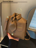 Step up your style game with the Playful Chic collared crossbody handbag! This fashion-forward accessory is perfect for the modern woman who isn't afraid to have a little fun. The unique collar shape adds a playful twist to your outfit. Get ready to turn heads and make a statement with this must-have handbag!