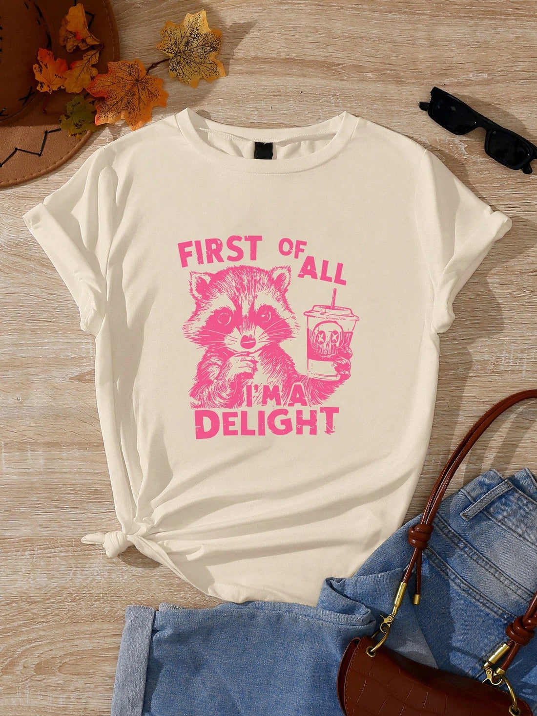 Get ready for summer with this quirky and playful pink raccoon graphic tee! Embrace retro style and stand out from the crowd with this unique design for women. Guaranteed to add some fun to your wardrobe!