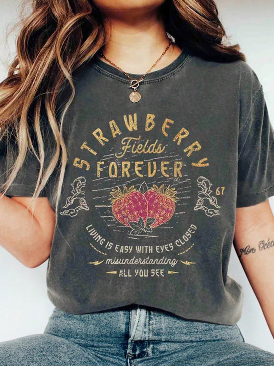 Add some fun to your wardrobe with our Playful Strawberry Print T-shirt! Featuring a playful strawberry design and a comfortable short sleeve round neck design, this shirt is perfect for any casual occasion. Show off your unique style and make a statement with this quirky and fun T-shirt. (Fruit puns not included).