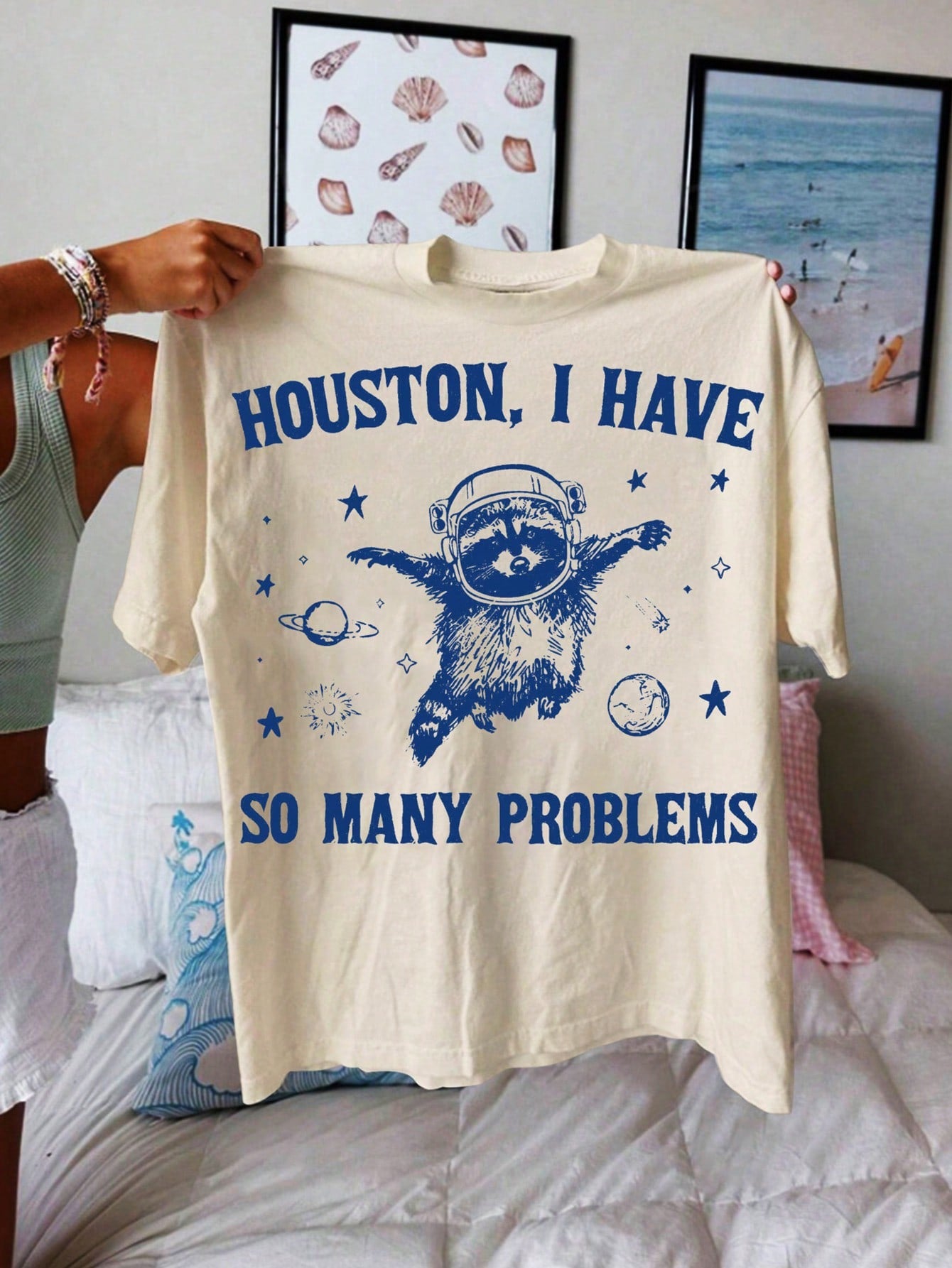 Bring some playful summer vibes into your wardrobe with our Raccoon Graphic Oversized Tee. Effortlessly stylish, this tee will add a fun touch to any outfit. Embrace your inner quirkiness with this must-have piece!