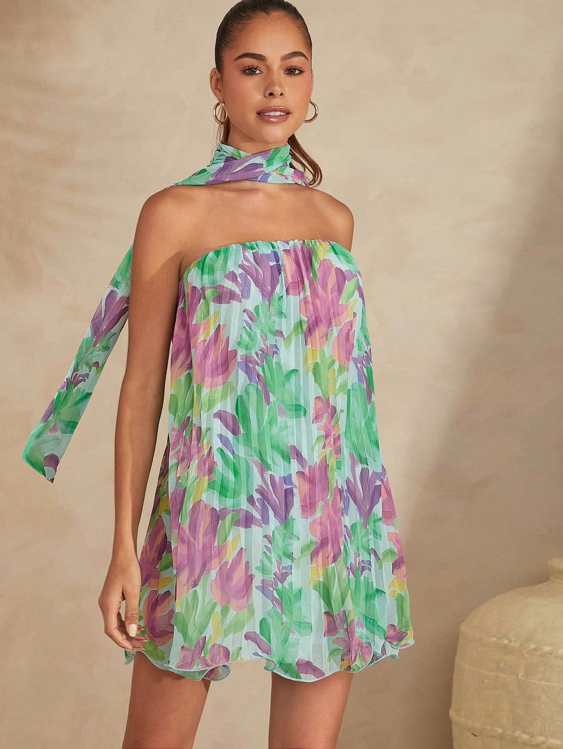 Wrap yourself in botanical bliss with this stunning pleated dress that's equal parts sophisticated and fun. The vibrant floral print brings life to any wardrobe, while the wrap neckline flatters every frame with effortless elegance. Pleated detailing adds movement and dimension, making this your go-to piece for everything from brunch dates to evening events. Comfortable enough for all-day wear, striking enough to turn heads—this dress proves you don't have to choose between style and substance.