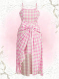 Introducing the must-have for curvy figures: our Plus Gingham Print Bow Front Cami Dress! This stylish midi dress is perfect for the summer with its playful gingham print and flattering bow front design. Stay cool and chic all season long!