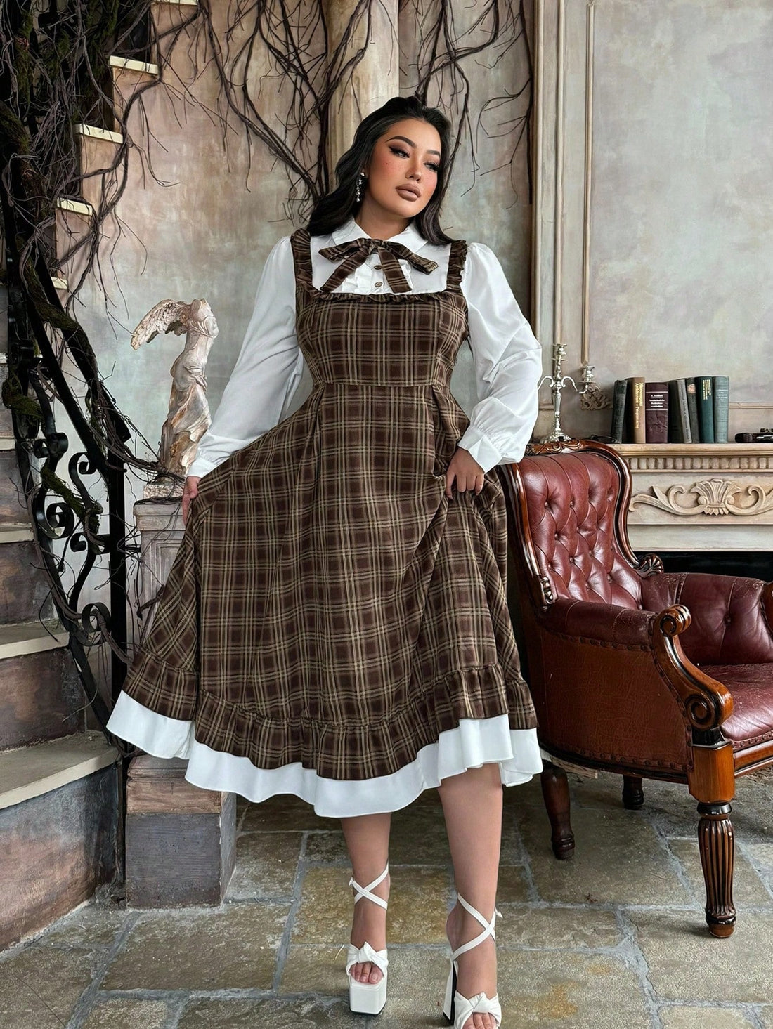Embrace cozy cottagecore vibes with this charming 2-in-1 plaid shirt dress! Layer it as a dress or wear the detachable piece as a standalone shirt for versatile styling options. The delicate ruffle hem adds a whimsical touch perfect for autumn and winter adventures. Thoughtfully designed for plus sizes, it offers comfortable fit without compromising on style. Whether you're exploring countryside trails or cozying up indoors, this plaid essential brings that effortless, romantic aesthetic to your wardrobe.