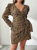 Make a bold statement in this plus-size zebra print wrap dress that effortlessly transitions from the office to festival season. The striking black and white pattern commands attention while the flattering cross-wrap silhouette hugs curves in all the right places. Versatile enough for professional settings yet fun enough for weekend adventures, this dress proves you don't have to choose between style and comfort. Dress it up with heels or down with sneakers—this wild print works with everything.