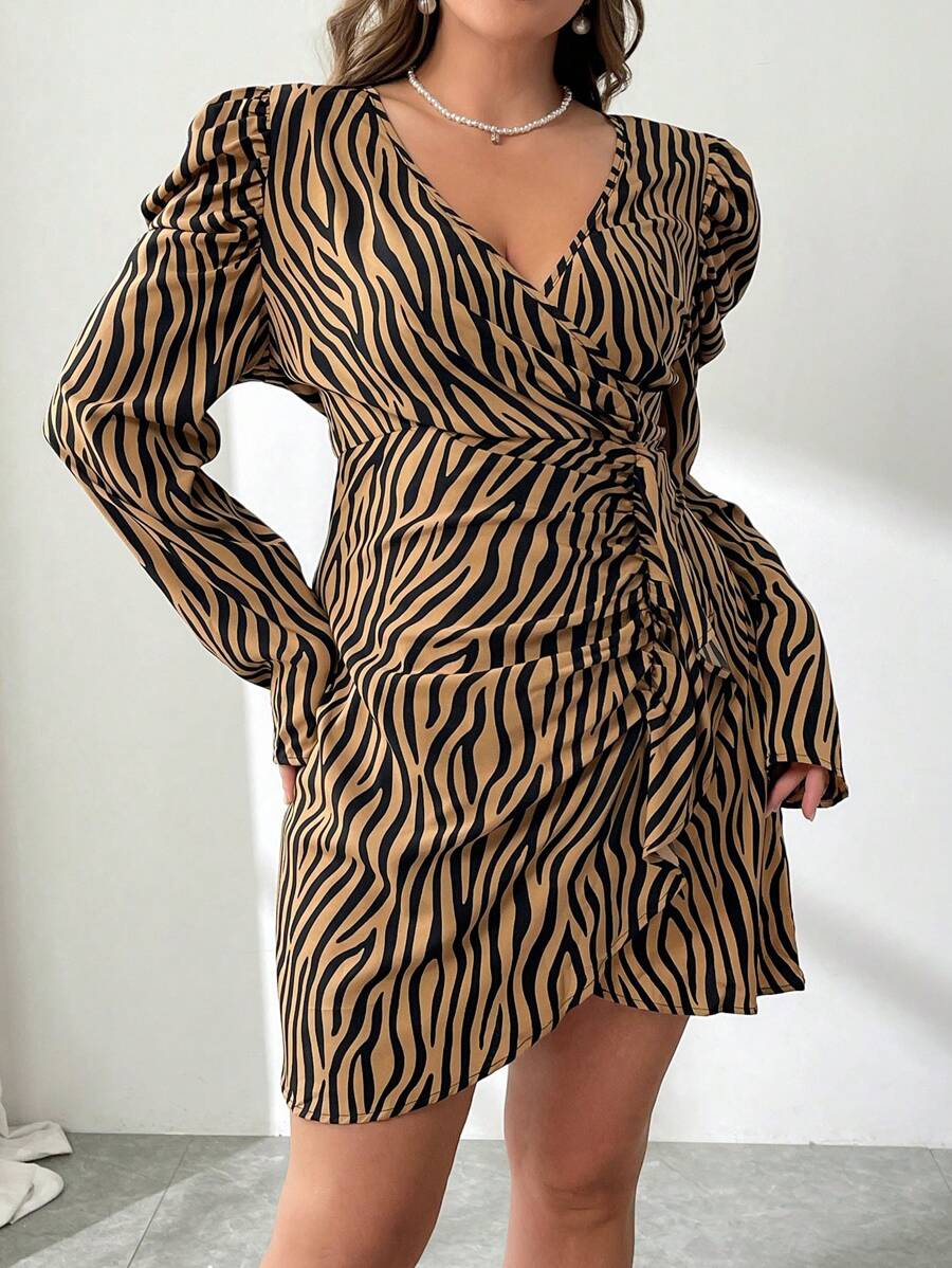 Make a bold statement in this plus-size zebra print wrap dress that effortlessly transitions from the office to festival season. The striking black and white pattern commands attention while the flattering cross-wrap silhouette hugs curves in all the right places. Versatile enough for professional settings yet fun enough for weekend adventures, this dress proves you don't have to choose between style and comfort. Dress it up with heels or down with sneakers—this wild print works with everything.