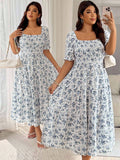 Embrace your curves in this playful plus size dress featuring a charming blue and white ditsy floral print. The flirty lantern sleeves add a whimsical touch, while the waist-cinching detail creates a flattering silhouette. Perfect for sunny days or casual outings, this dress combines comfort and style effortlessly.