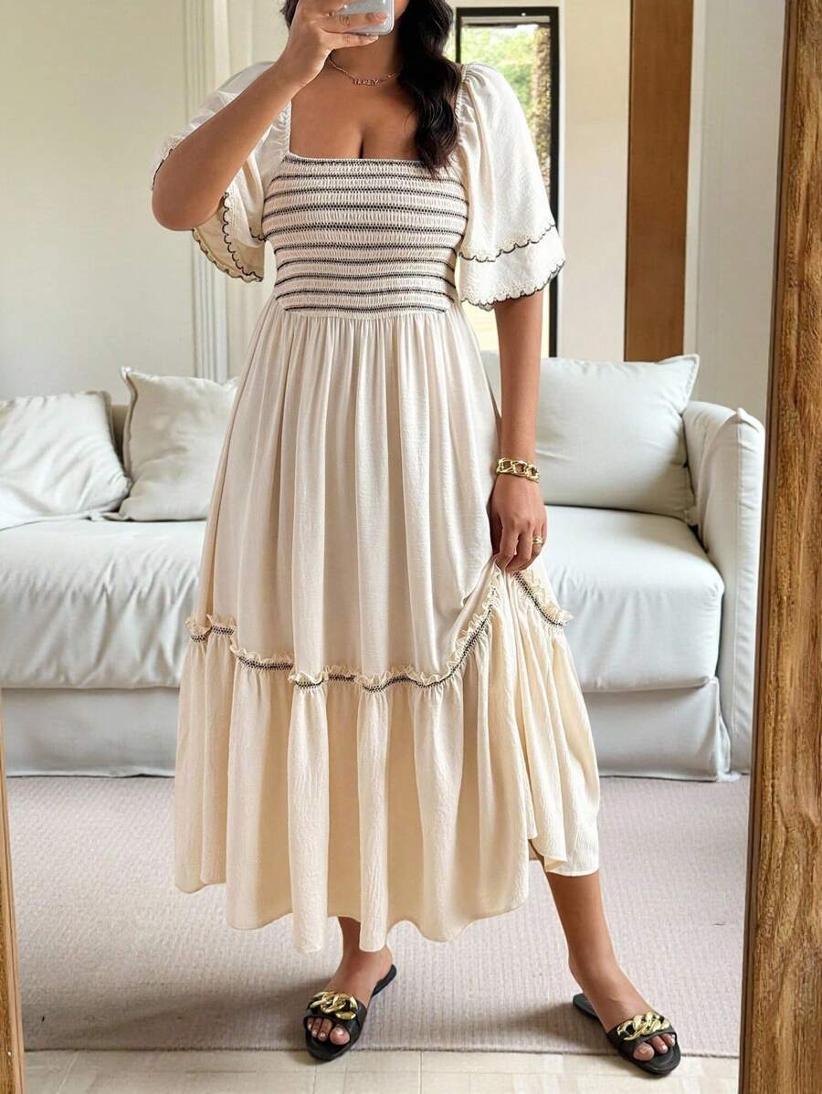 Embrace effortless elegance with this Plus Size Bohemian Beach Dress, designed to flatter and flow. Featuring a breathable fabric and a stylish square neckline, it offers both comfort and sophistication. The embroidered ruffle hem adds a delicate artisan touch, perfect for beach strolls or casual summer gatherings. Crafted to enhance your silhouette while allowing ease of movement, this dress is a versatile wardrobe essential for warm-weather days.