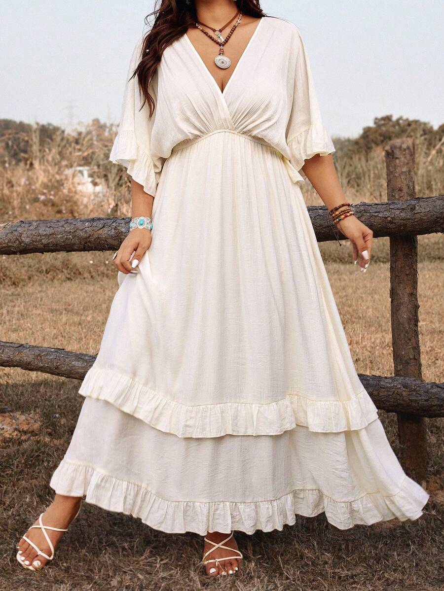 Embrace effortless elegance with this plus-size bohemian maxi dress, designed for warm-weather adventures. The tie-front detail adds a flattering, adjustable fit while the flowing silhouette moves beautifully with you. Crafted in crisp white, it transitions seamlessly from beach days to casual dinners, making it the perfect vacation essential. The relaxed bohemian style celebrates comfort without compromising on sophistication, ideal for spring and summer getaways or everyday wear that feels like a retreat.