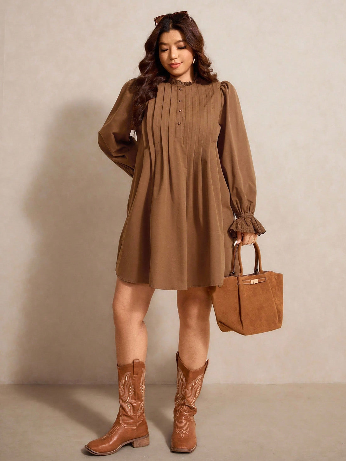 Embrace your curves in this charming brown dress that effortlessly blends romance with everyday comfort. Delicate lace patchwork details dance across a flattering pleated silhouette, creating dimension and movement that celebrates your figure. The casual-yet-elegant design transitions seamlessly from brunch dates to evening gatherings, proving that plus-size fashion can be both fun and fabulous. Soft, breathable fabric keeps you feeling confident all day long, while the thoughtful construction ensures a pol