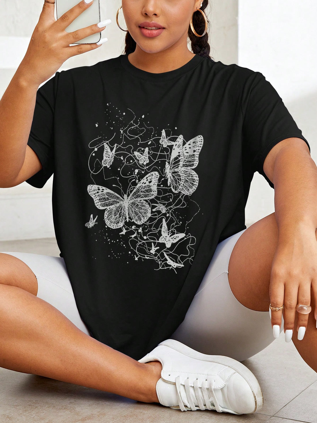 Celebrate summer in style with this playful plus size butterfly graphic tee designed just for women. Its vibrant butterfly print adds a touch of whimsy, while the comfortable fit keeps you feeling cool and confident all day long. Perfect for sunny days and casual outings, this chic t-shirt brings a fun, fresh vibe to your wardrobe.
