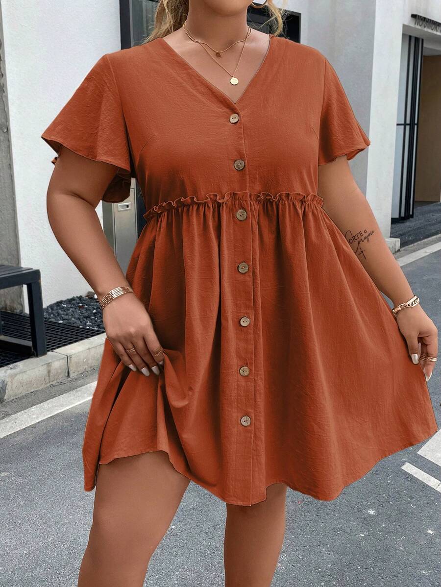 Flatter your curves in this Plus Size Button Front Frill Trim Smock Dress designed for fun and effortless style. With charming button details and playful frill trim, it offers a breezy silhouette that moves with you. Perfect for days when you want to feel fabulous with zero fuss!