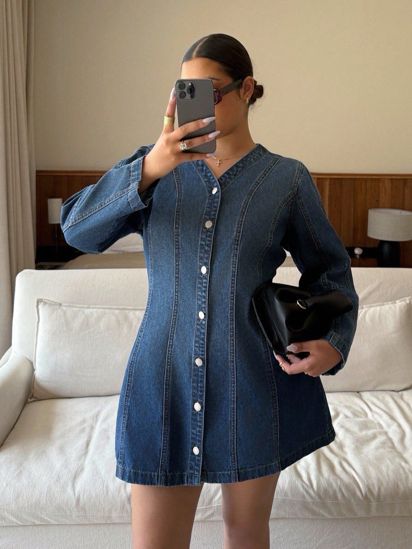 Slip into effortless style with this plus-size denim dress that goes everywhere you do. The classic front button design offers easy layering and a flattering fit, while the relaxed silhouette keeps you comfortable from morning commute to evening plans. Whether you're heading to work, catching a flight, or dancing at a party, this versatile wardrobe staple delivers timeless appeal with a modern edge. Dress it up with heels or keep it casual with sneakers—this denim essential adapts to your vibe and your sche