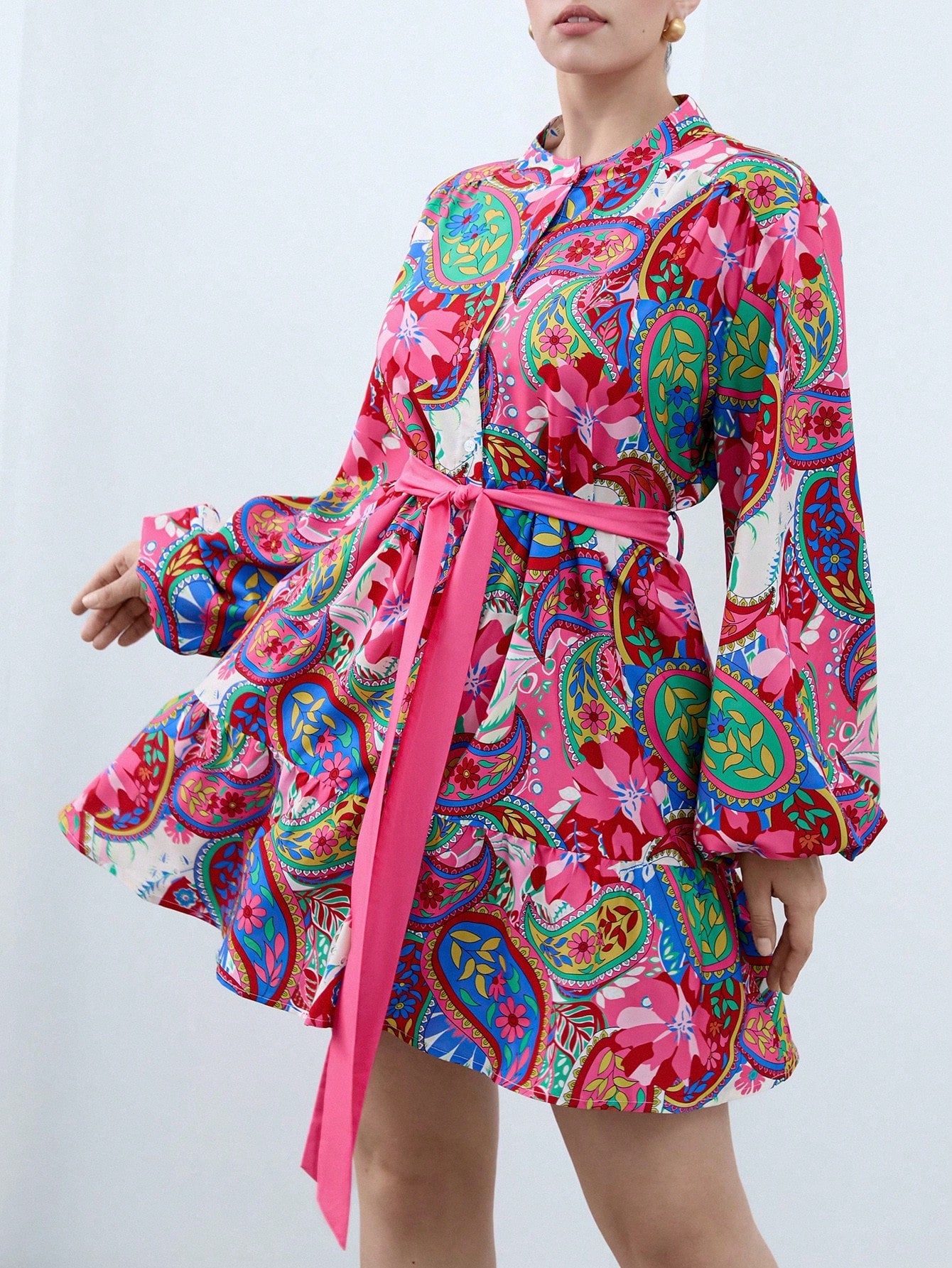 Step out in style with this playful plus size dress featuring a bold geometric print and a flattering belted waist. Its long sleeves offer comfort and coverage, making it perfect for casual days when you want to feel effortlessly chic. Easy to wear and fun to flaunt, this dress adds a splash of personality to your everyday wardrobe.