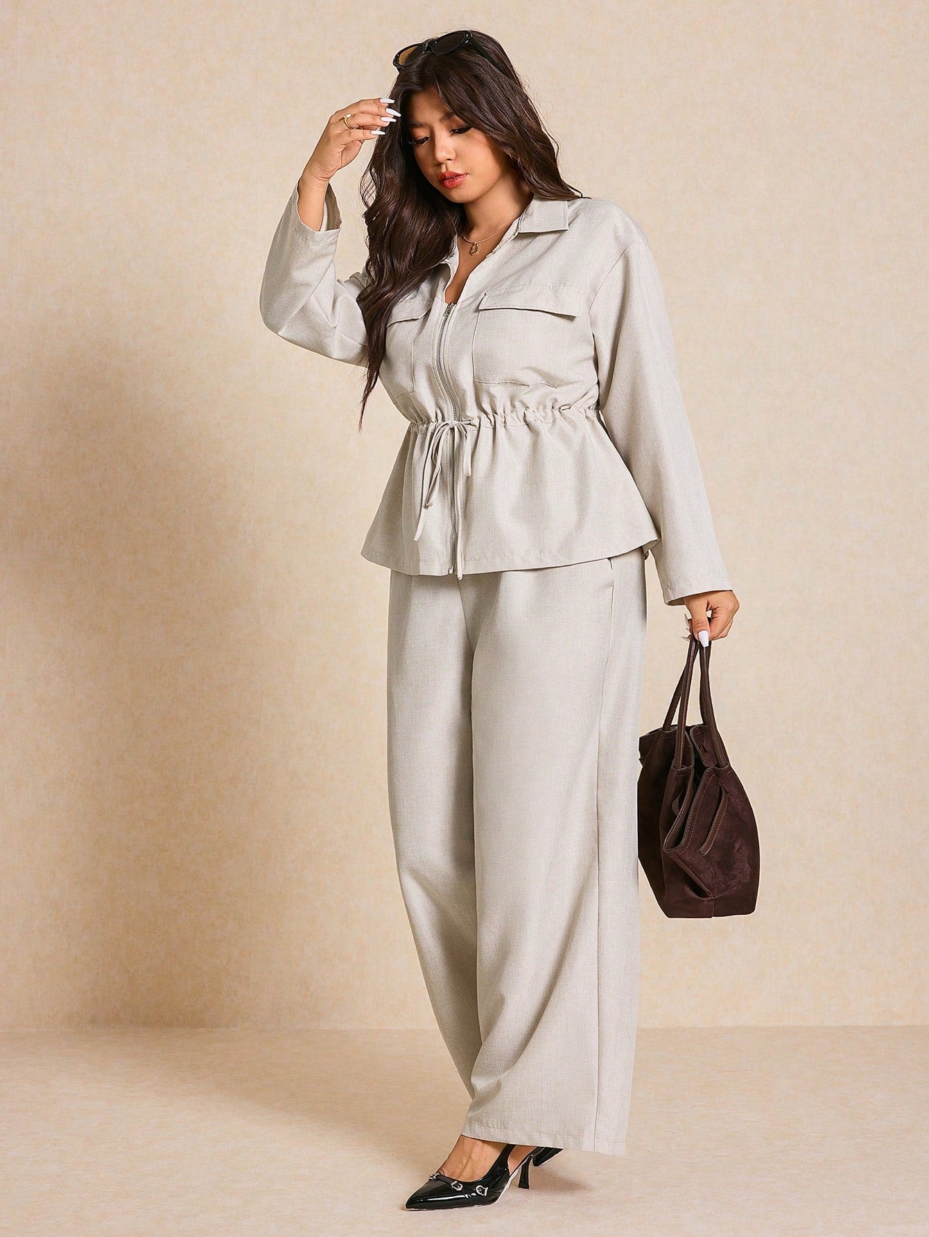 Embrace effortless style with this chic 2-piece set designed for the modern woman. The waist-cinched silhouette flatters your curves while the minimalist cut keeps things fresh and contemporary. Crafted in a warm apricot hue that's perfect for autumn transitions, this set pairs beautifully for casual outings or relaxed weekends. The thoughtful design balances comfort with sophistication, making it your go-to for looking put-together without trying too hard. Versatile enough to dress up or down, this set pro