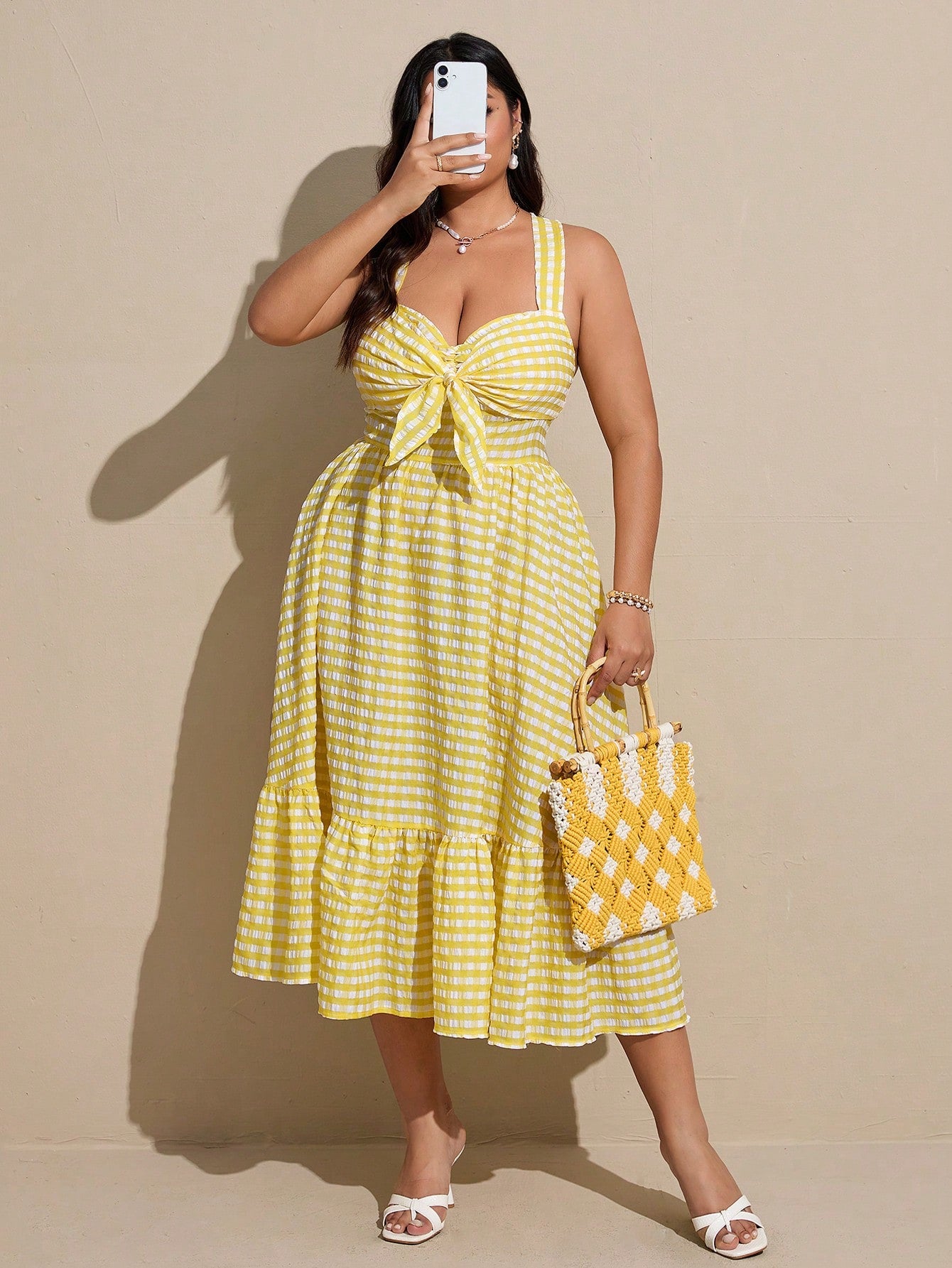Step out in style with this playful plus size casual plaid dress featuring trendy criss-cross back straps. Its comfortable fit and charming pattern make it perfect for everyday wear, while the unique back detail adds a fun twist to your look. Effortless style has never been this easy!