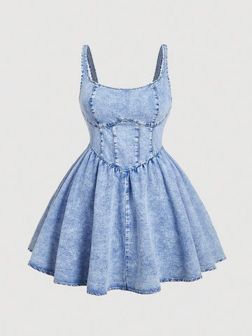 Front view of light wash denim cami mini dress with flared skirt