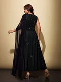 Back view of black glitter plus size maxi dress with flowing asymmetric shoulder drape