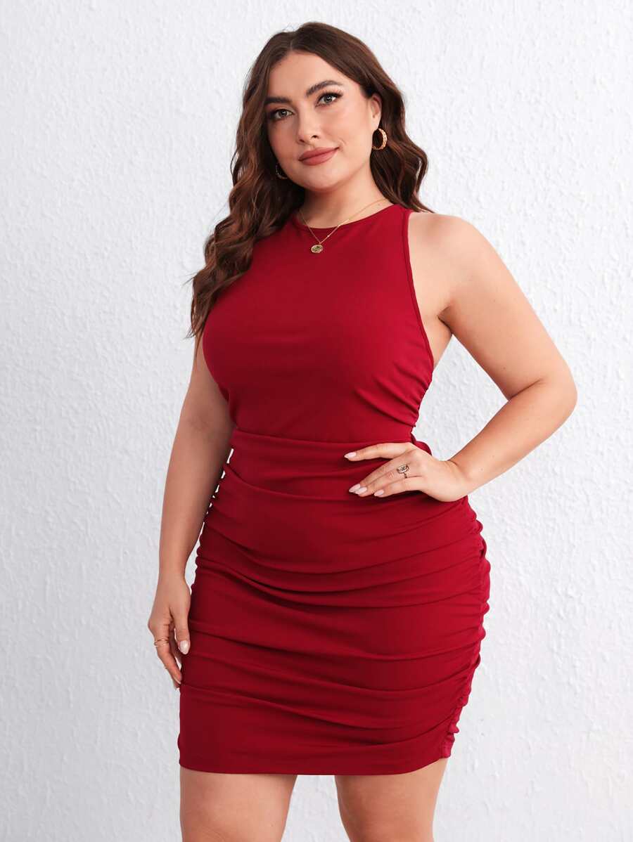 Turn heads in this stunning plus-size bodycon dress that celebrates your curves with style! The crisscross backless design creates an alluring silhouette, while strategic ruching flatters your figure beautifully. Perfect for date nights, parties, or whenever you want to feel confident and fabulous, this dress combines bold fashion with comfort. The sleek bodycon fit hugs you in all the right places, making it a versatile go-to for any occasion where you want to make a statement. Dress it up with heels or ke