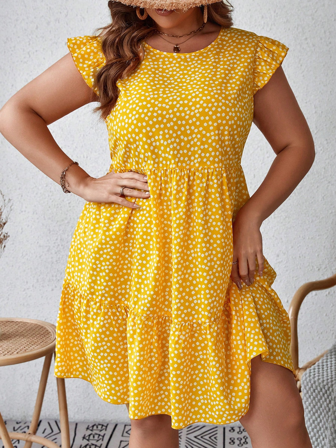 Dazzle this summer with our Plus Size Ditsy Floral Dress! Featuring a playful ruffle hem and a quirky ditsy floral print, this smock dress is the perfect addition to your summer wardrobe. Stay stylish and comfortable with this perfect summer style!