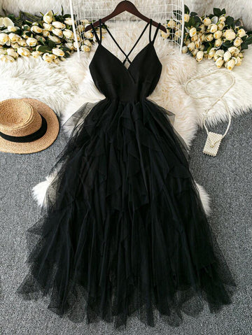 This plus size dusty blue cami dress brings playful elegance with its crisscross straps and tiered tulle skirt. Perfect for romantic summer dates, it flatters your silhouette while adding flirty movement to every step. Embrace effortless charm and stay cool in this dreamy, whimsical dress made for making memories.
