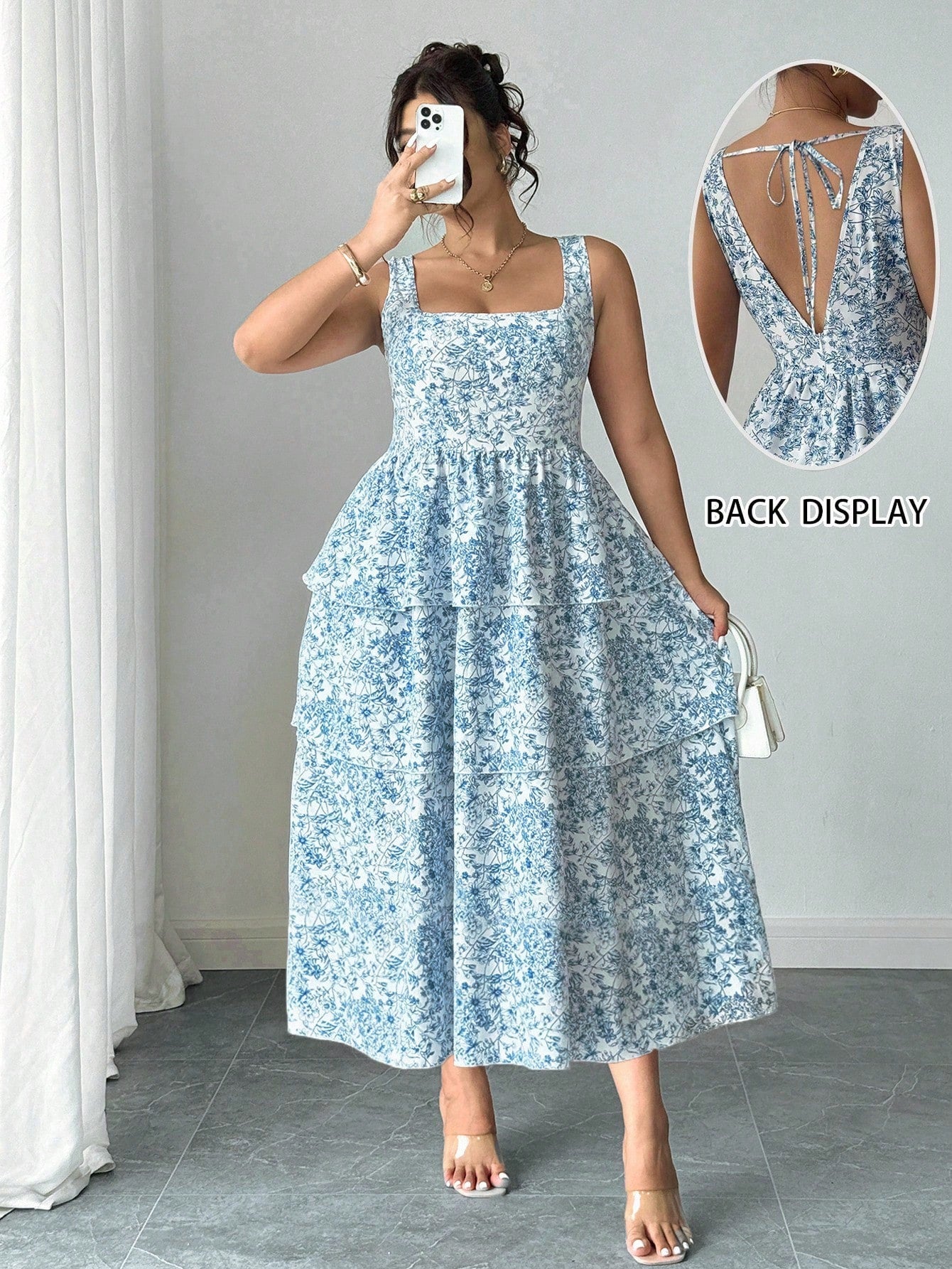 Step into summer with this playful plus size mini dress, adorned with charming ditsy floral prints. Its sleeveless design keeps you cool while the elegant cut flatters your curves, making it perfect for sunny days and casual outings. Embrace effortless style and comfort in this fun, flirty dress made just for you.