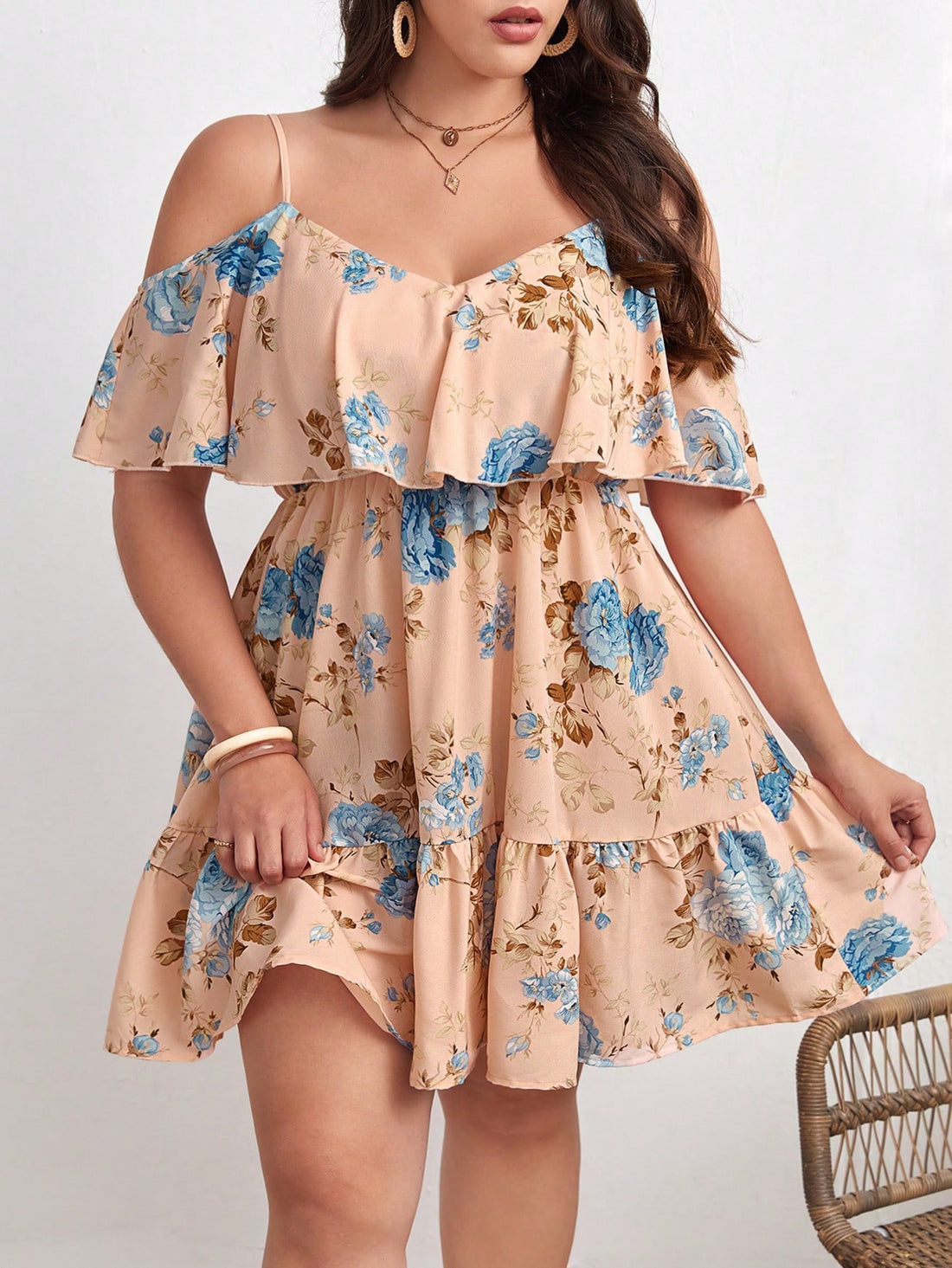 Embrace sunny days in this playful plus size boho sundress featuring a charming floral print and trendy cold shoulder design. The ruffle hem adds a flirty touch, perfect for beach holidays or casual summer outings. Lightweight and breezy, it keeps you cool while celebrating your curves with effortless style.