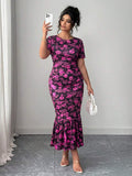 Hot pink floral knit dress side view with flounce hem