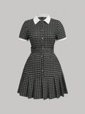 Front view of black check polo collar belted pleated shirt dress
