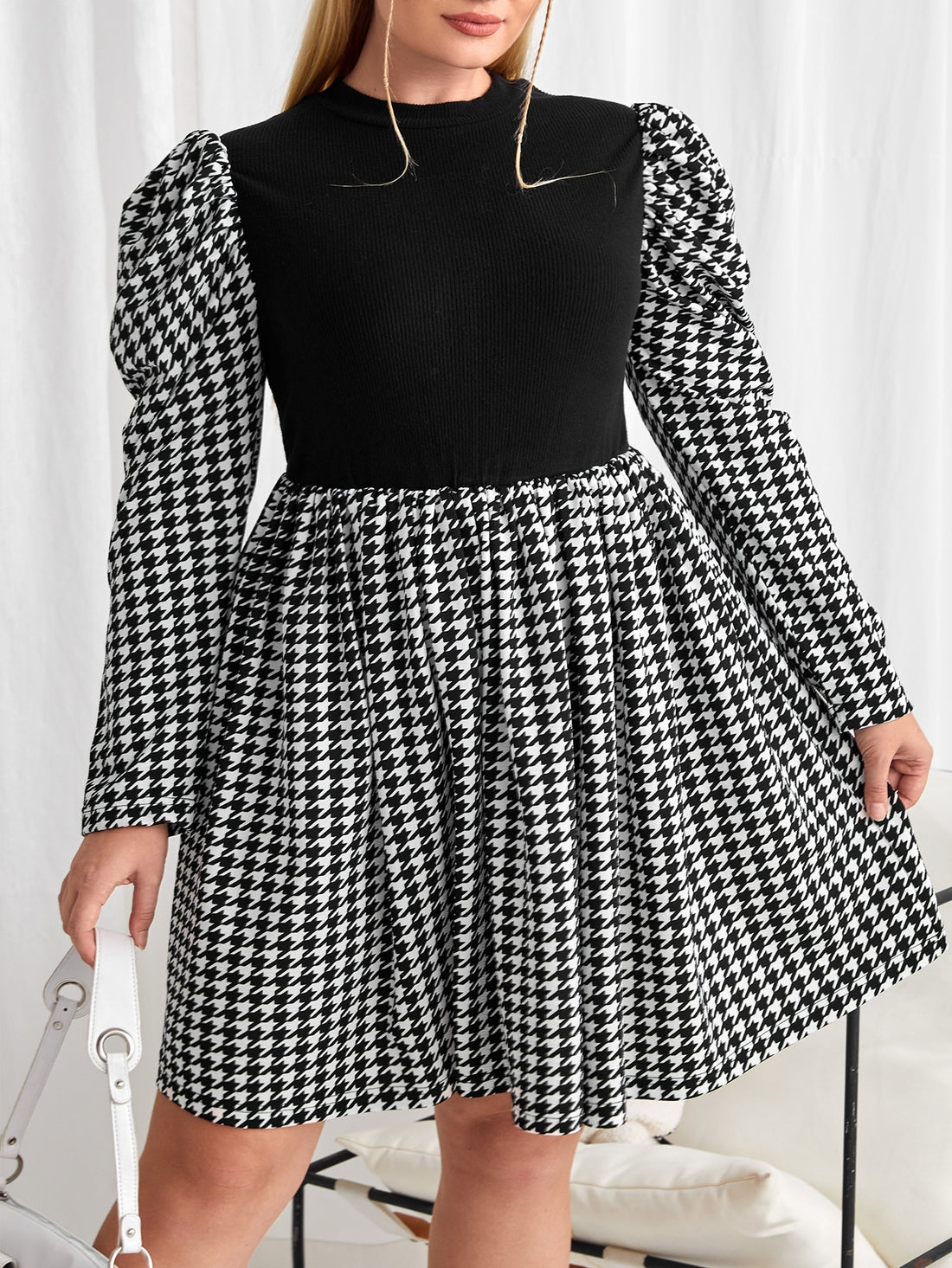 Step out with flair in this Plus Size Houndstooth Print Gigot Sleeve Dress. Its bold print and puffed sleeves bring a playful twist to classic chic, making it a standout piece for any occasion. Comfortable yet stylish, it’s perfect for turning heads while embracing your unique vibe.