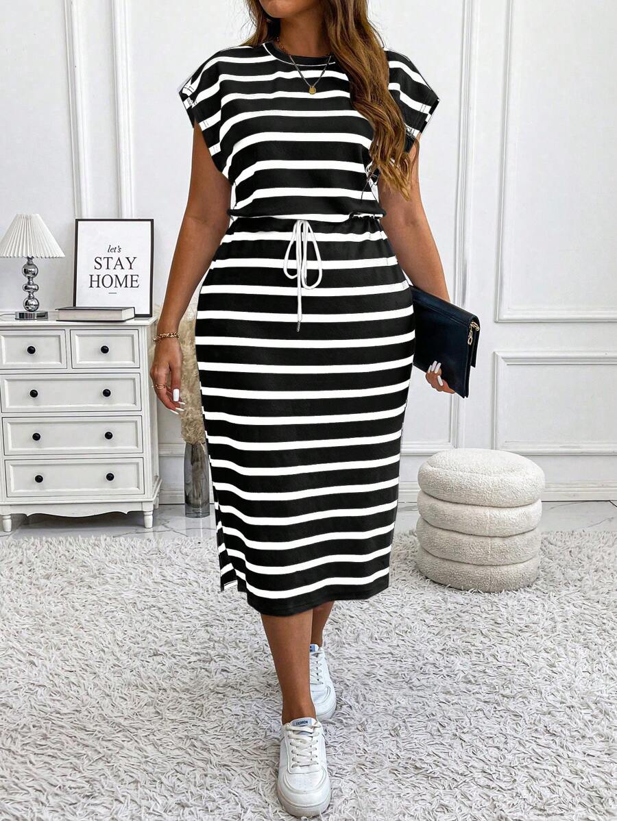 Cozy up in style with this playful plus size knitted striped dress, perfect for autumn and winter days. The drawstring waist hugs your curves while adding a fun, adjustable fit, and the side slit gives a cheeky peek for effortless flair. Whether you're lounging or out on the town, this maxi dress blends comfort and casual chic with a dash of boldness.