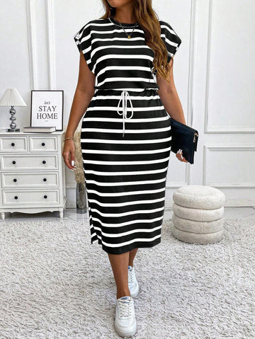 Cozy up in style with this playful plus size knitted striped dress, perfect for autumn and winter days. The drawstring waist hugs your curves while adding a fun, adjustable fit, and the side slit gives a cheeky peek for effortless flair. Whether you're lounging or out on the town, this maxi dress blends comfort and casual chic with a dash of boldness.