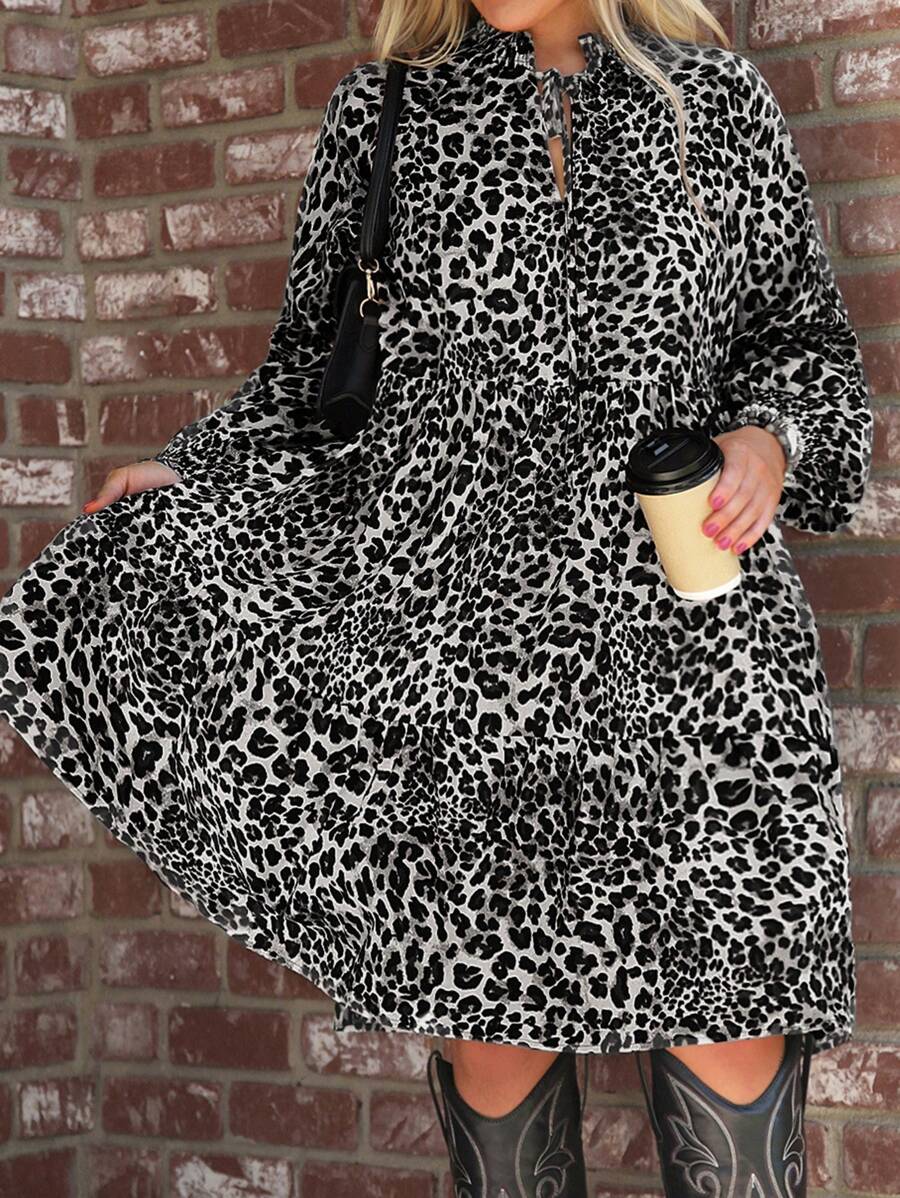 Step into the spotlight with this playful plus size leopard print dress, designed to turn heads at any holiday party. Featuring a charming tie neck, whimsical lantern sleeves, and a flirty ruffle hem, it blends bold style with comfortable elegance. Celebrate in confidence and let your wild side shine!