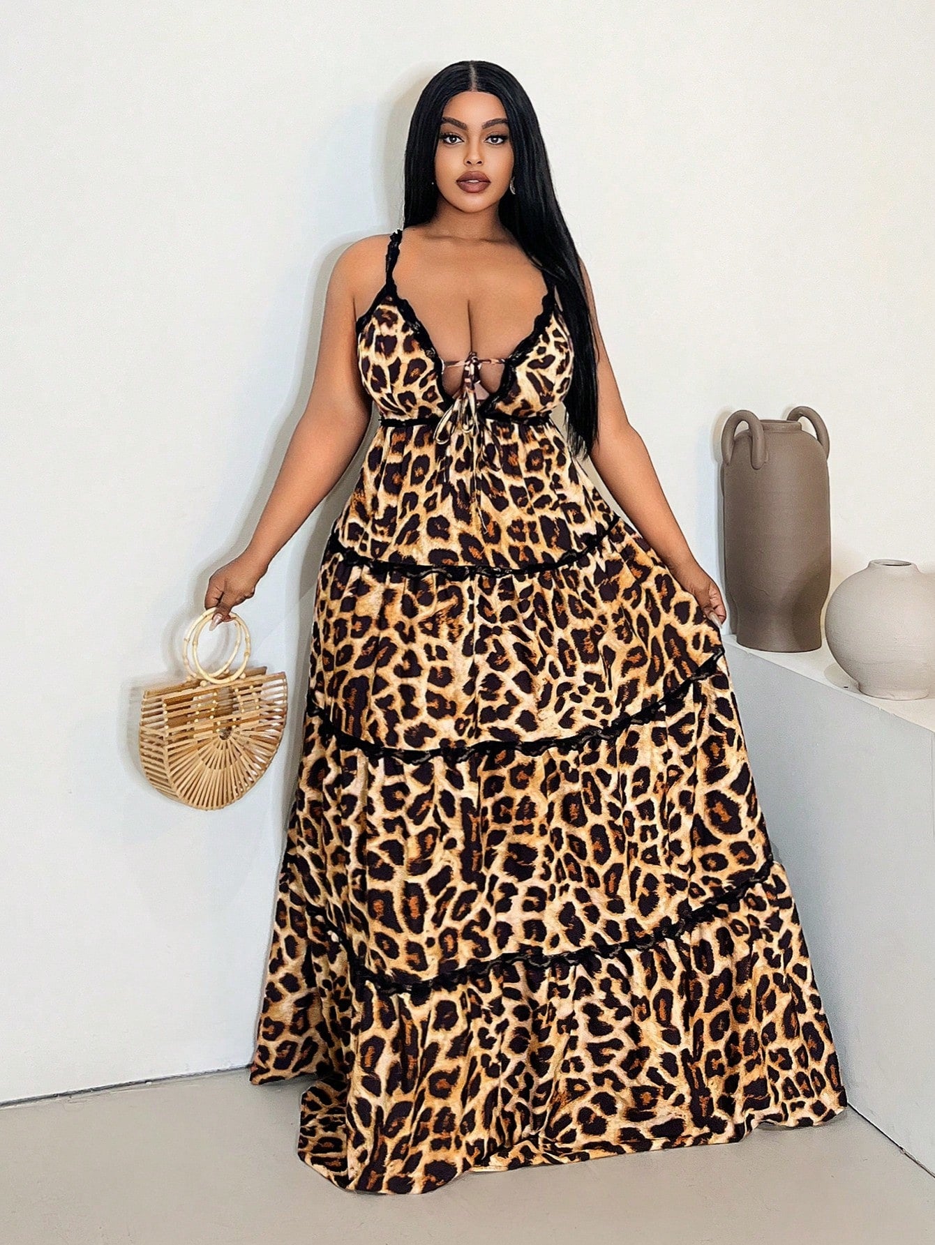 Unleash your wild side with this fabulous plus size leopard print dress! The flirty V-neckline and delicate spaghetti straps create a flattering silhouette, while the eye-catching lace patchwork adds a touch of unexpected glamour. Perfect for turning heads at your next night out or adding some fierce fun to your everyday wardrobe!