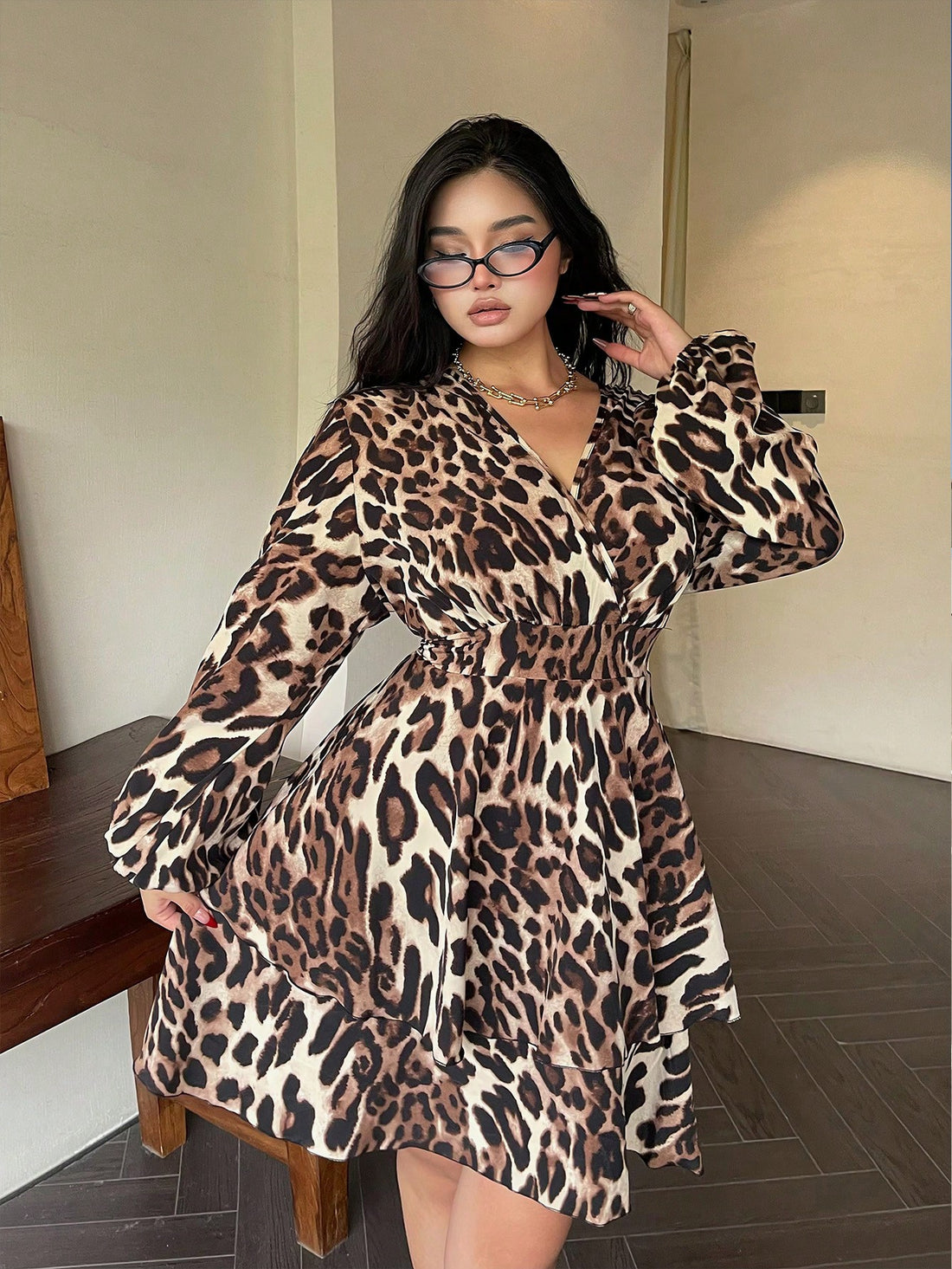 Elevate your style game with our Plus Size Leopard Print V-Neck Wrap Dress! This trendy dress features a flattering wrap design, v-neckline, and long sleeves for added sass. Perfect for any occasion, this dress will have you feeling confident and stylish all day long! (Rawr!)