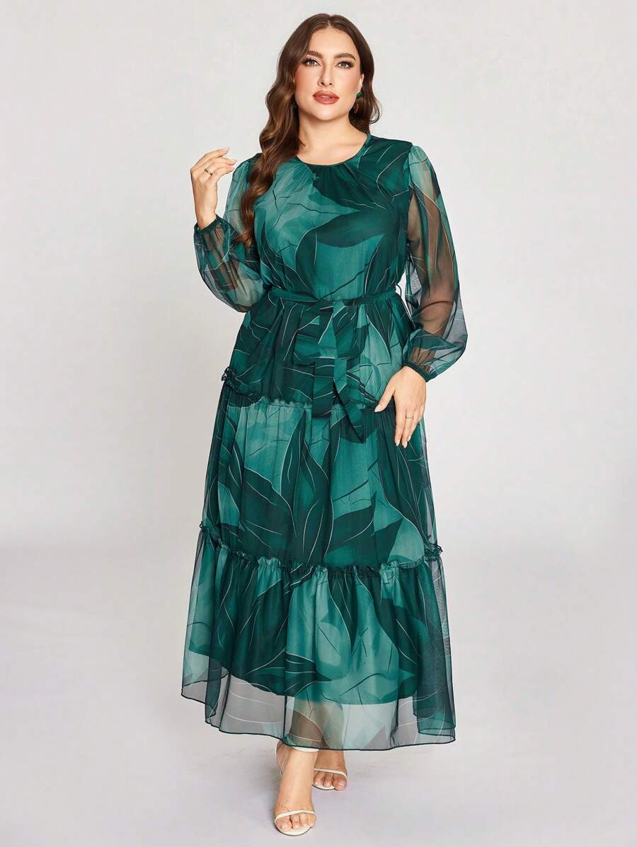 Embrace your curves with confidence in this stunning plus-size dress that's equal parts chic and comfy! Featuring delicate floral prints dancing across breathable mesh fabric, this long-sleeve beauty channels timeless Arabic-inspired elegance with a modern twist. The flowing silhouette flatters every figure while the intricate design details make you feel like the main character wherever you go. Perfect for date nights, celebrations, or whenever you want to turn heads without trying too hard. Slip it on and