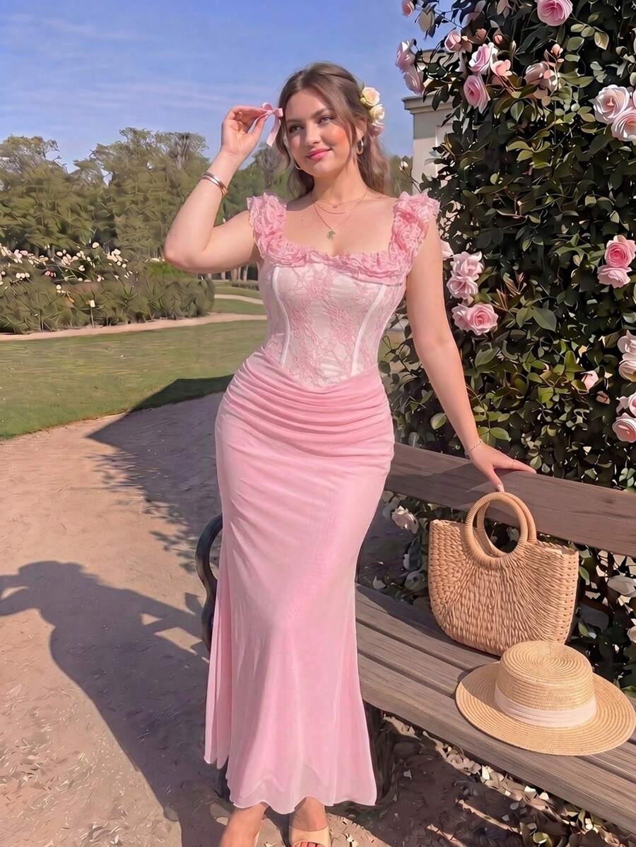 Model wearing blush pink mermaid maxi dress with ruched straps beside roses