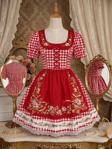 Front view of red gingham floral A-line dress with puff sleeves and lace-trimmed hem