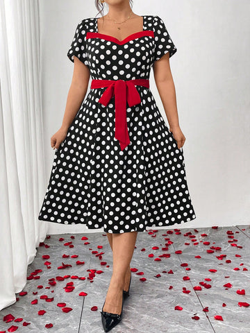 Step into the spotlight in this charming plus-size polka dot dress that blends vintage allure with modern elegance. The cinched waist creates a flattering silhouette that celebrates your curves, while classic polka dots add a playful, timeless touch. Perfect for parties, date nights, or any occasion calling for a dash of retro-inspired style. This dress proves that fashion-forward doesn't mean compromising on comfort or confidence. Twirl, dance, and shine in a piece designed to make you feel absolutely fabu