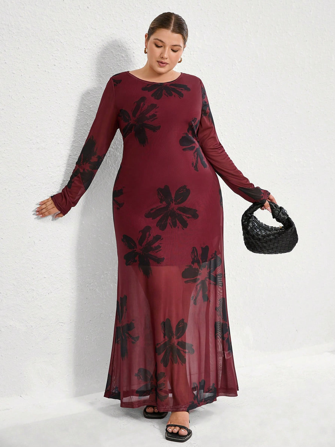 Turn heads in this playful plus size bodycon dress featuring a bold red contrast print and a flirty mesh insert. The chic crew neck adds a touch of sophistication while hugging your curves for a confident, stylish look perfect for any occasion.