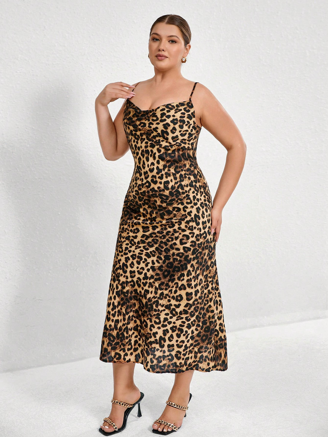 Unleash your wild side with our Plus Size Sexy Leopard Print Backless Cami Dress! This bold and stylish animal print dress is perfect for women who want to make a statement. Show off your curves and stand out from the crowd. (Rawr!)
