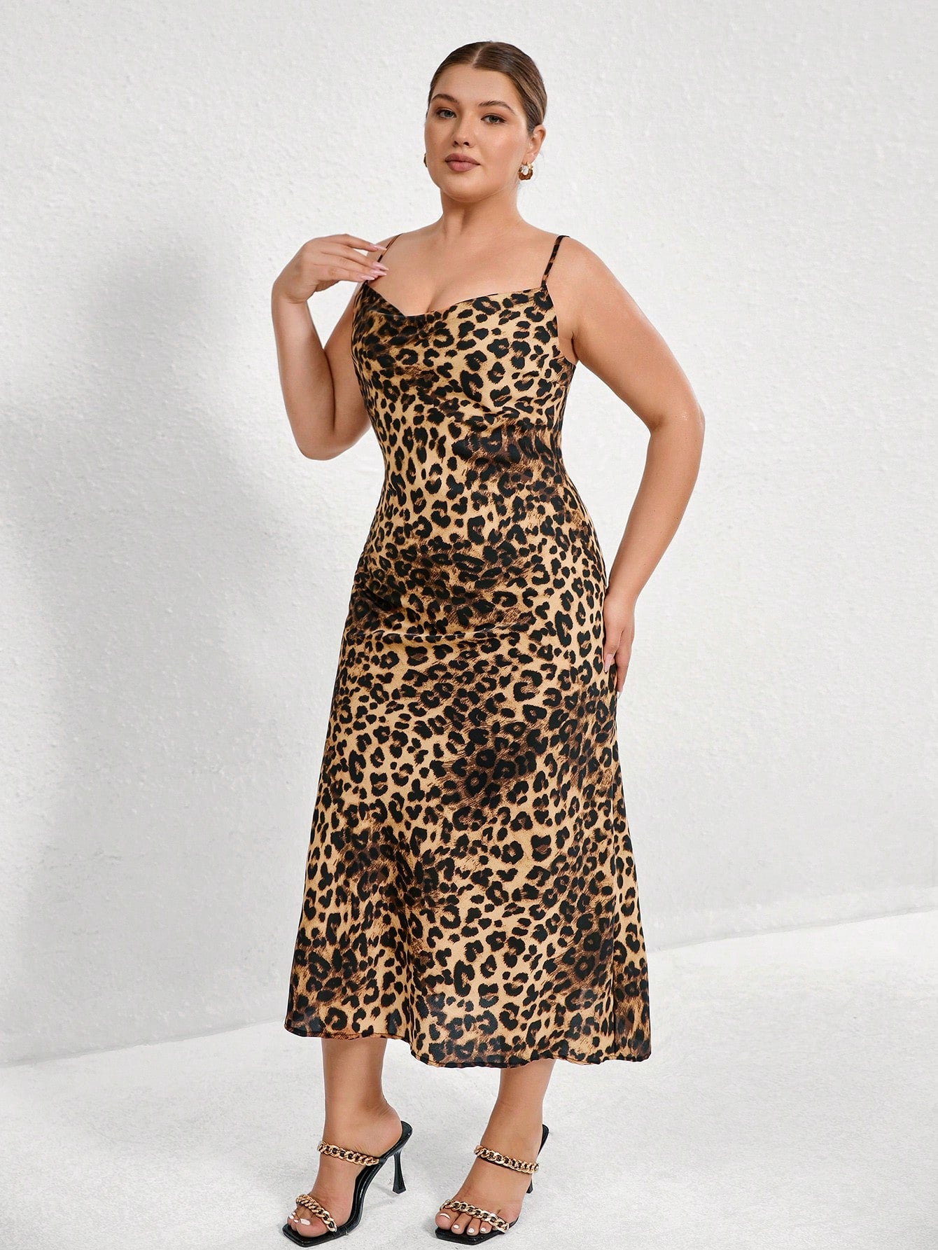 Unleash your wild side with our Plus Size Sexy Leopard Print Backless Cami Dress! This bold and stylish animal print dress is perfect for women who want to make a statement. Show off your curves and stand out from the crowd. (Rawr!)