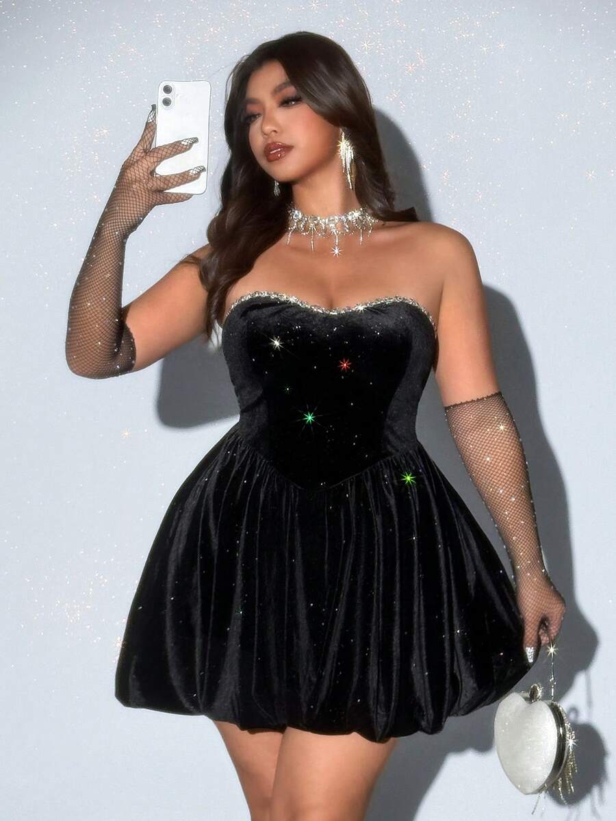 Front view of black strapless embellished peplum mini dress for evening styling