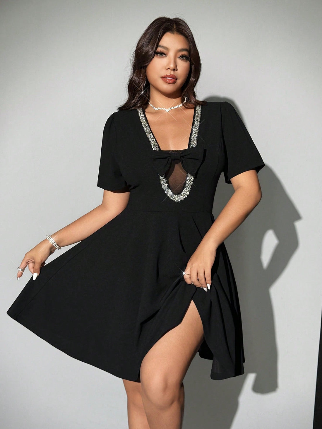 Step out in style with this playful plus size short sleeve dress featuring a charming bow tie detail. Designed to flatter your curves, it combines elegance with a fun twist, making it perfect for any occasion—from brunch dates to evening gatherings. Comfortable and chic, this dress lets you express your personality while feeling fabulous all day long.