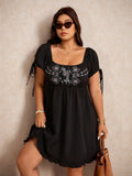 Step into summer with this playful plus size fit & flare dress. Its minimalist black design is brightened by delicate embroidery, creating an elegant yet casual look perfect for holiday adventures or sunny days out. Flattering to your shape and breezy to wear, this short dress combines comfort with effortless style.
