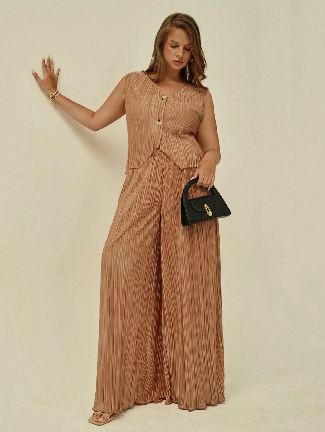 Elevate your wardrobe with this fabulous 2-piece set that's ready for anything! The lightweight vest pairs perfectly with flowing wide-leg trousers, creating an effortlessly chic silhouette that flatters and moves with you. Whether you're conquering the office or jet-setting on vacation, this versatile combo transitions seamlessly from boardroom to beachside. Designed for comfort and style, it's the ultimate power move for anyone who refuses to compromise on looking absolutely stunning.