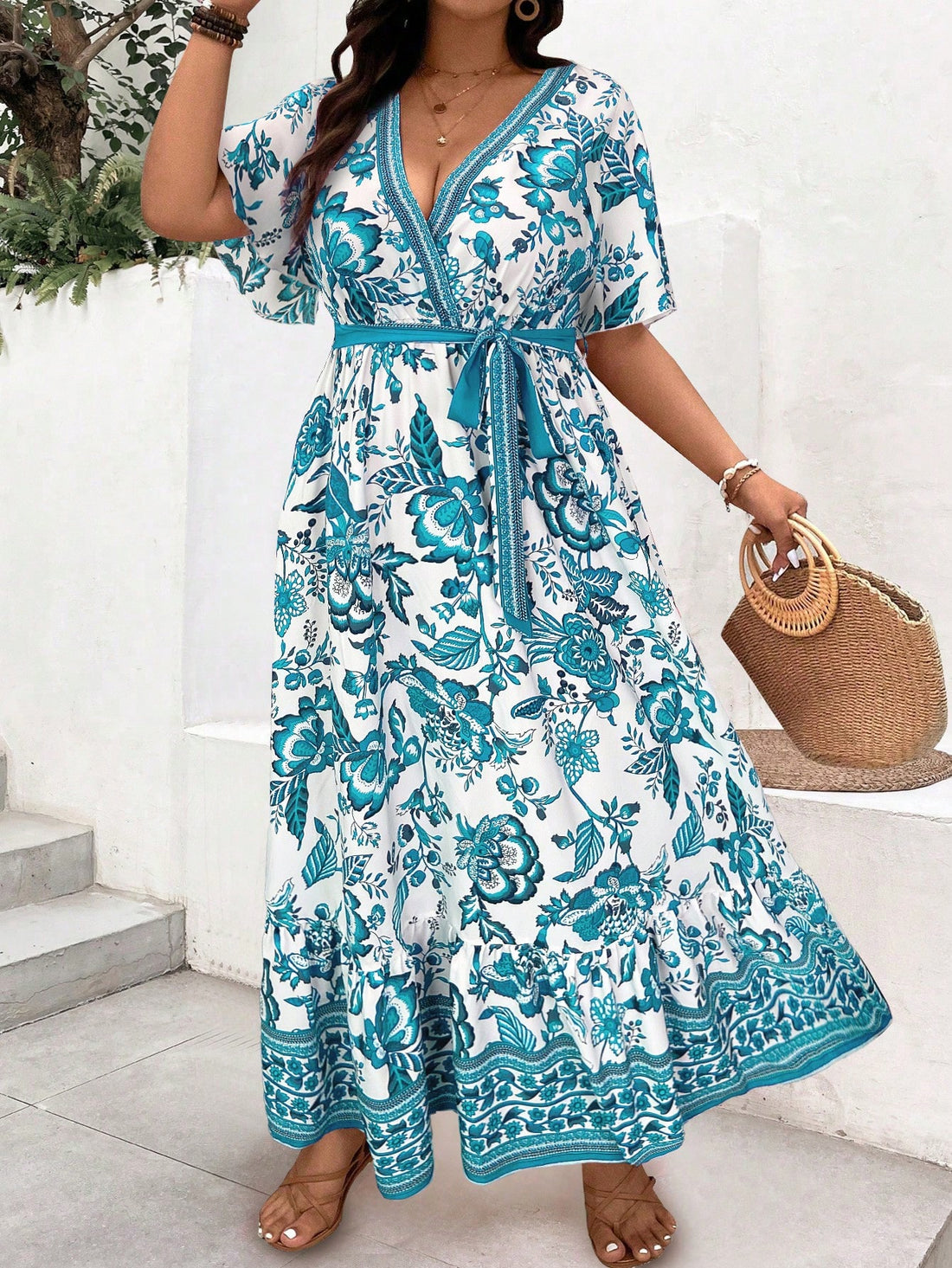 Sway into vacation mode with this eye-catching plus size midi dress! Featuring a vibrant abstract art print inspired by tropical paradises, this dress combines comfort with head-turning style. The playful ruffle hem adds just the right amount of flirty movement whether you're sipping cocktails beachside or dancing under the stars. Your holiday wardrobe just got a fabulous upgrade!