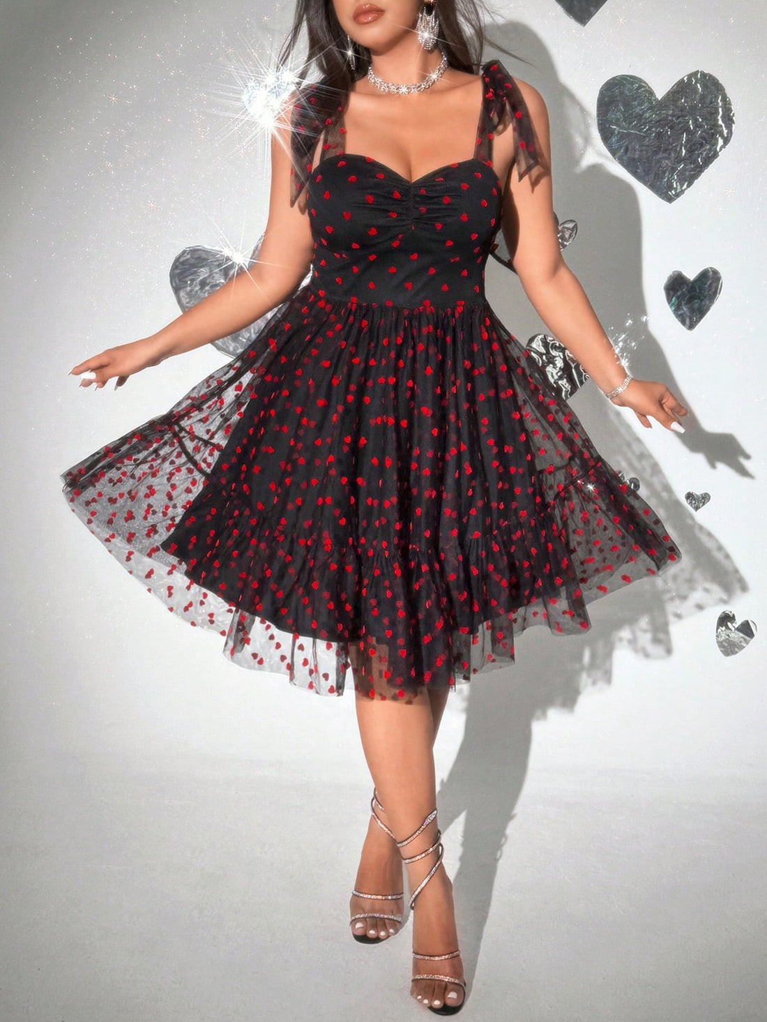 Celebrate love in style with this Plus Size Valentine's Day Heart Bow Tulle Flocked Dress. Featuring a charming heart pattern and a playful bow detail, its soft tulle fabric adds a flirty, romantic touch. Designed to flatter and feel comfortable, this dress is perfect for making your Valentine’s Day unforgettable.