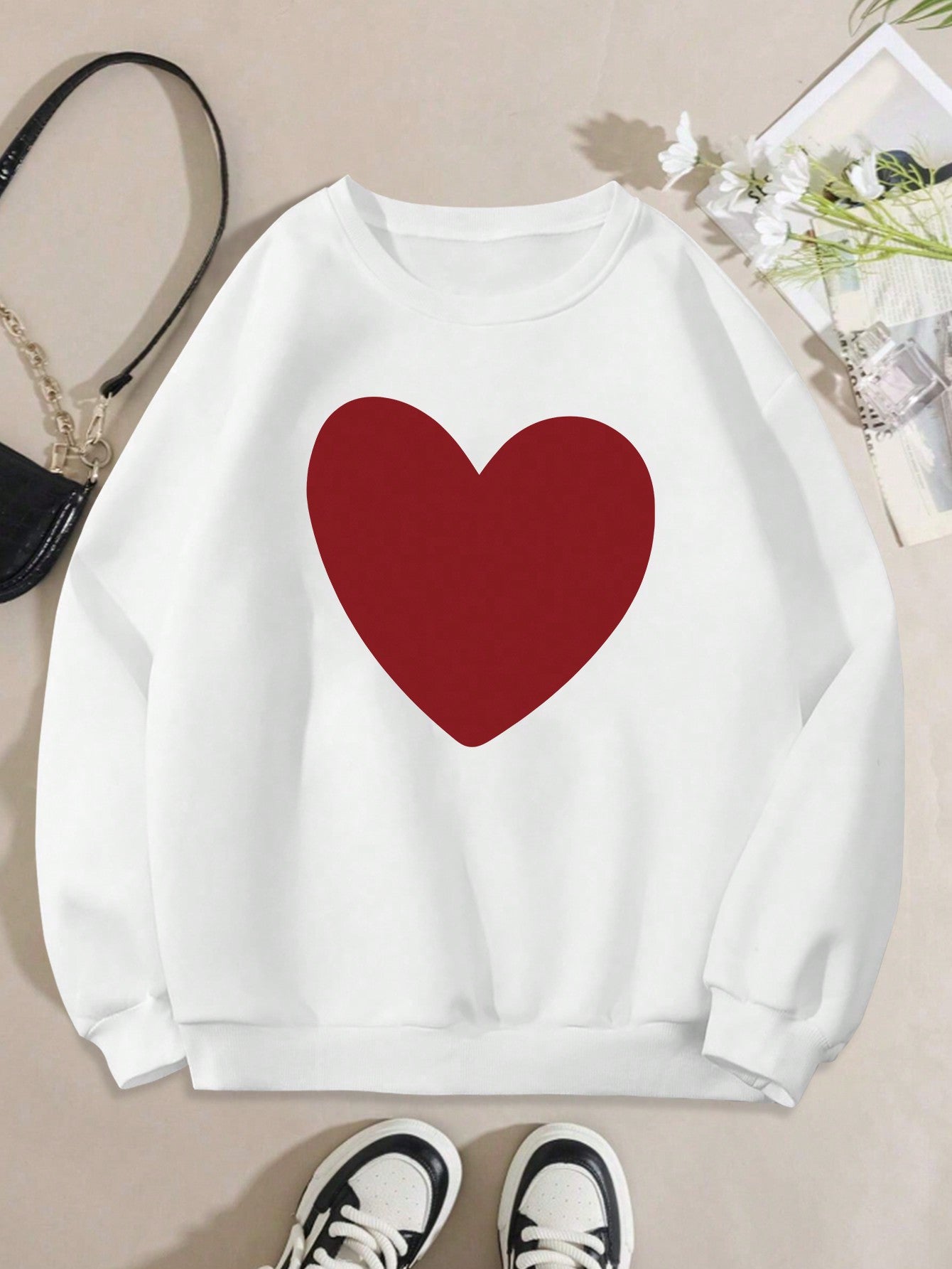 Celebrate love in style with our Plus Size Valentine's Day Heart Pattern Sweatshirt for Women. This cozy sweatshirt features a playful heart pattern, perfect for the romantic holiday. Its plus size ensures a comfortable fit for all body types. Spread love and warmth with this sweatshirt.