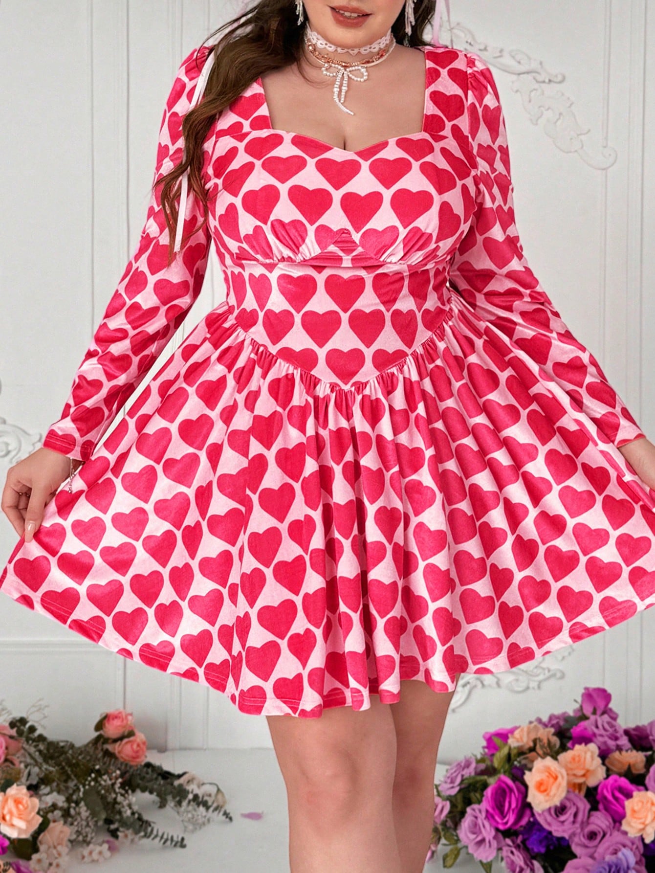 Get ready to turn heads this Valentine's Day with our Plus Size Velvet Heart Dress! Designed with elegant floral polka dots and cupid graphics, this dress is perfect for a romantic evening out. Show off your unique style and impress your date with this quirky and playful outfit choice. (Single and ready to mingle? This dress will definitely catch someone's eye!)